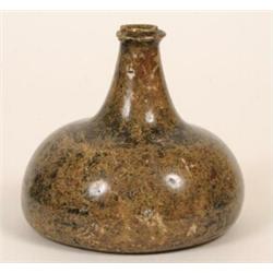 A 17th Century Onion Shaped Glass Wine Bottle, 12 cm  See illustration  £150-200...