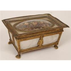 A French Gilt Metal and Mother of Pearl Jewellery Casket, the hinged cover inset a dried flower d...