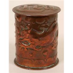 A Newlyn Copper Cylindrical Tea Caddy, with cover, embossed a dragon, 10 cm  See illustration  £2...