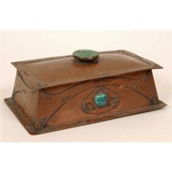 An Art Noveau Hammered Copper Casket, the cover applied a circular finial decorated a lady, 27 cm...