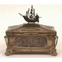 An Art Nouveau Pewter Casket, the sides with silver coloured metal embossed panels, the hinged co...