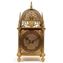 A Late 19th Century German Brass Lantern Clock, with Roman numerals, striking the quarters on tin...