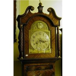 A Long case Clock, the 35 cm arched square brass dial with Arabic numerals, fitted a three train...