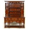 Image 1 : A George III Style Oak Dresser, cross banded, the dentil cornice above a shaped and pierced friez...