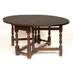 An Early 18th Century Oak Gateleg Table, on knopped baluster turned legs, 134 cm  See illustratio...
