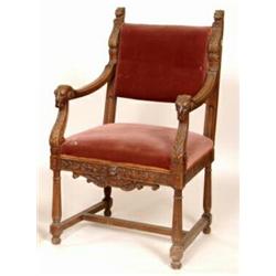 A Continental Walnut Armchair, with lion finials, and ram head carved arms  See illustration  £60...