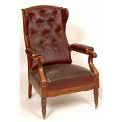 A William IV Adjustable Mahogany Library Armchair, with winged back, padded arms and upholstered...