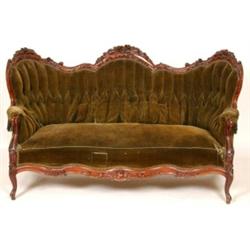 A 19th Century American Style Settee, the walnut frame carved with floral bouquets, the deep butt...
