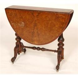 A Victorian Burr Walnut Sutherland Table, on carved baluster end supports joined by a fold stretc...