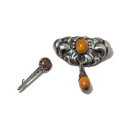 Two Skonvirke Silver Brooches with Amber, Denmark, around 1910