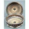 Image 1 : SILVER - A pair of George III bottle coasters, with boldly gadrooned sides and rims, draught tur...