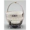 Image 1 : SILVER - A Victorian circular sugar basket, on four cast ram's head capped hoof feet, the deep s...