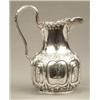 Image 1 : SILVER - A Victorian milk jug, of oval baluster form, chased and embossed with lobed panels divi...