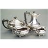 Image 1 : SILVER - A four-piece boat shaped tea service, on ball feet, half lobed and fluted, with gadroon...