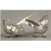 Image 1 : SILVER - A pair of well modelled figures of pheasants, 9.5in long, import marks London 1963, 19o...