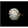 Image 1 : JEWELLERY AND WATCHES - An 18ct gold opal and diamond cluster ring, the central oval opal within...
