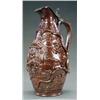 Image 1 : BRITISH POTTERY - A brown glazed stoneware jug, relief moulded two Tudor boys and fruiting vines...