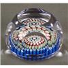 Image 1 : GLASS - A millefiori circular paperweight, cut with roundels, 2.5in wide...