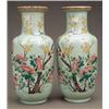 Image 1 : ORIENTAL CERAMICS AND WORKS OF ART - A pair of Chinese baluster vases, painted in 'famille rose'...