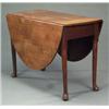 Image 1 : FURNITURE AND DECORATIONS - A George II oak oval pembroke dining table, on tapering column legs...