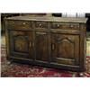 Image 1 : FURNITURE AND DECORATIONS - A George II oak enclosed low dresser, North Wales, fitted three rais...