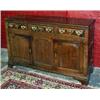 Image 1 : FURNITURE AND DECORATIONS - A George II oak enclosed low dresser, North Wales, with rounded moul...