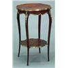 Image 1 : FURNITURE AND DECORATIONS - A brass mounted mahogany and kingwood two-tier occasional table, in...