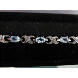 Ladies six carat Blue Topaz & Diamond bracelet