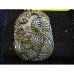 Carved agate pendant with tiger motif