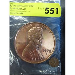 Over Scale replica of a US liberty penny.