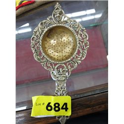Antique ornate Devil head tea strainer