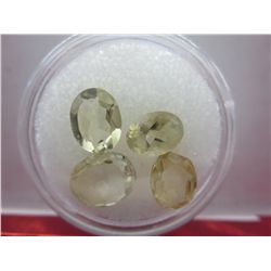 Four oval cut yellow citrine gemstones