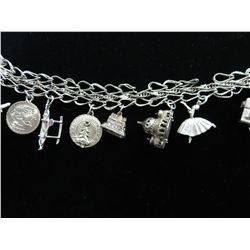 Estate sterling silver charm bracelet, w/ 9 charms