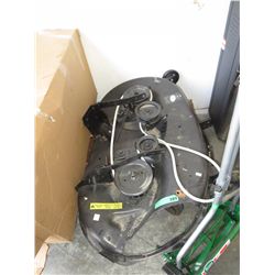 Lower attachment for a ride on lawnmower