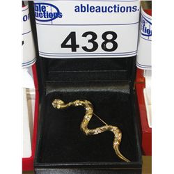 GOLD COLORED SNAKE BROOCH WITH 2 GENUINE DIAMONDS SET IN THE EYES. APPROX 4" LONG