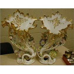 A pair of Continental vases (some damage). £100-150