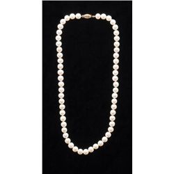 One strand of fine white pearls with 14k yellow  gold clasp.  Est.:  $225 - $300