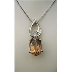 Stunning Imperial Topaz and Diamond Pendant with  oval topaz weighing 13.83 carats of amazing peach