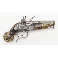 Miquelet flintlock ball butt pocket size pistol  with ornate pierced brass inlay circa 17th  century