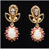 Image 1 : One pair of vintage earrings set with 2 fine  quality opals surrounded by rubies and diamonds.   Est