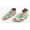 Image 1 : Pair of exceptional Sioux moccasins with parch  fleche soles and intricate geometric details; a 9+