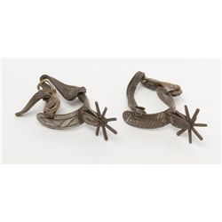 Pair of Mexican dress spurs with silver inlay and  original leather straps circa 19th to early  20th