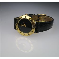 Ladies Swiss Made Gucci Watch in Excellent  condition with 18 karat bezel rimmed with roman  numeral