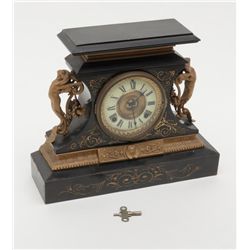 Romantic style mantle clock with fancy metal  mounts and onyx base showing Angels at sides and  doub