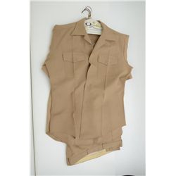 Two U.S.M.C. tan shirts and one pair of tan  paints.   U.S. Naval Commander’s dress jacket.   Possib