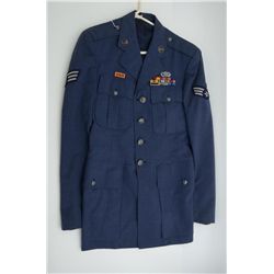 Two U.S.A.F. dress jackets with patches, badges  and ribbons.  Possibly reproduction.  Est.:   $100-