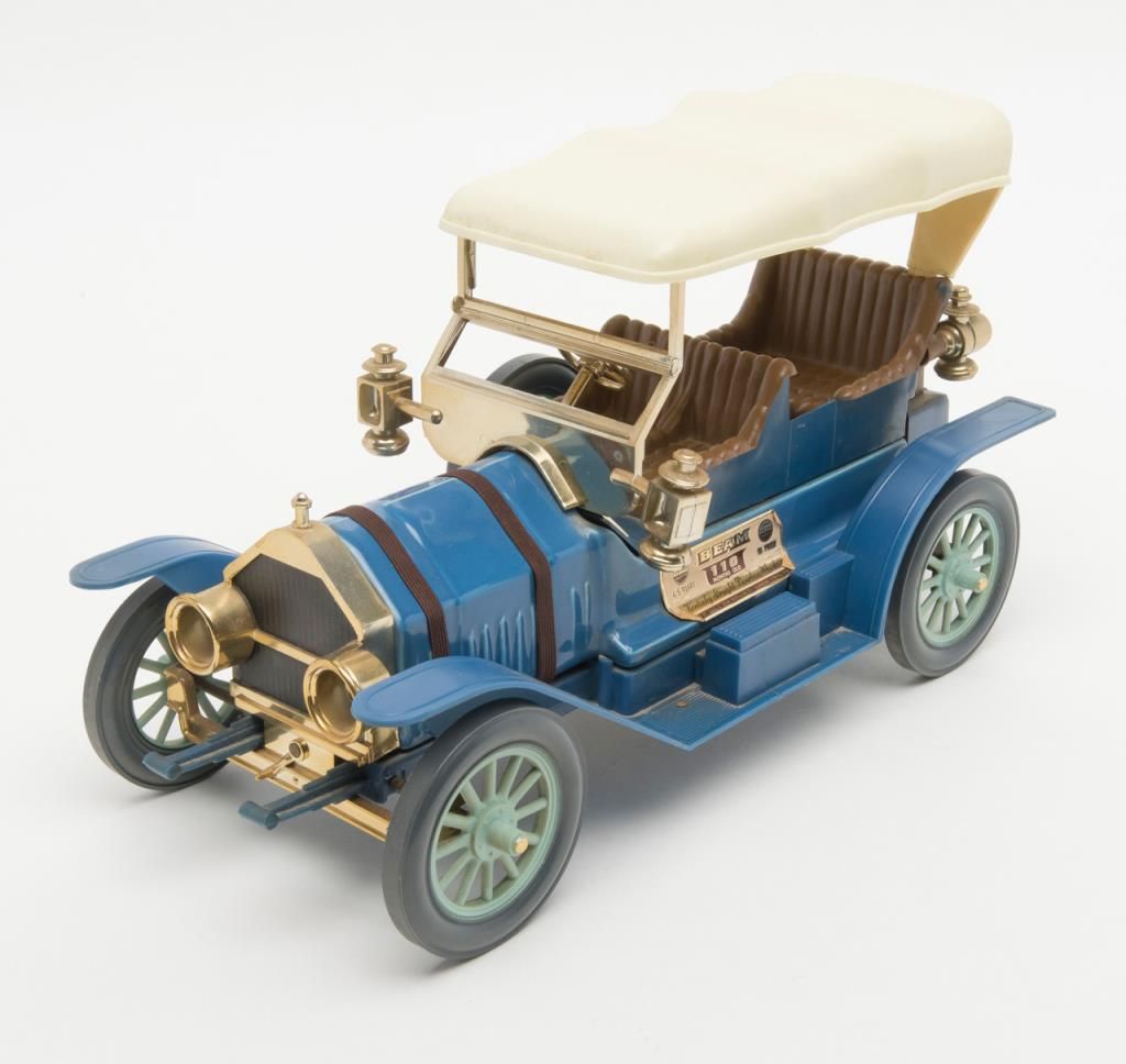 Lot of 9 Jim Beam collector series car decanters. Est. 50100.