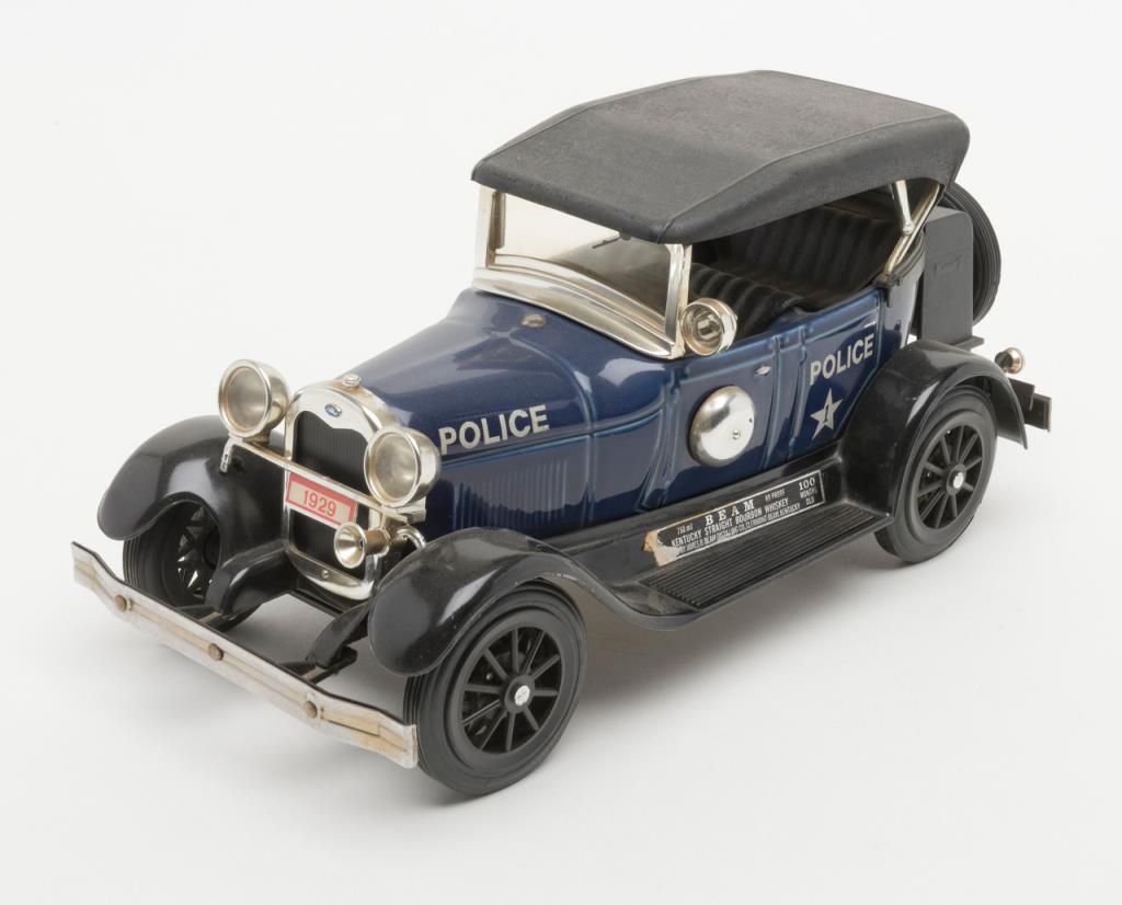 Lot of 9 Jim Beam collector series car decanters. Est. 50100.