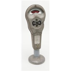 Old style metal parking meter by Rockwell, approx.  22” tall; a great decorator.   Est.:  $60-$120.