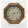 Image 1 : Modern octagon Howard Miller oak wall clock  approx. 20” in diameter, battery operated.     Est.:  $